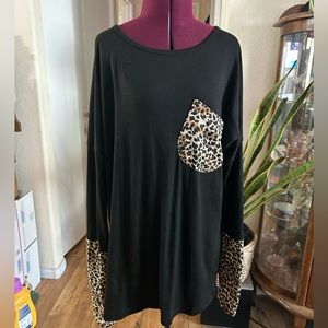 POGTMN Long Sleeve Black Top With Animal Print Detail.